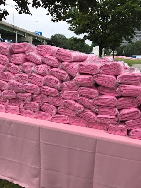 Custom branded Pink Polar Fleece Blankets for a Picnic Event for corporate gifting